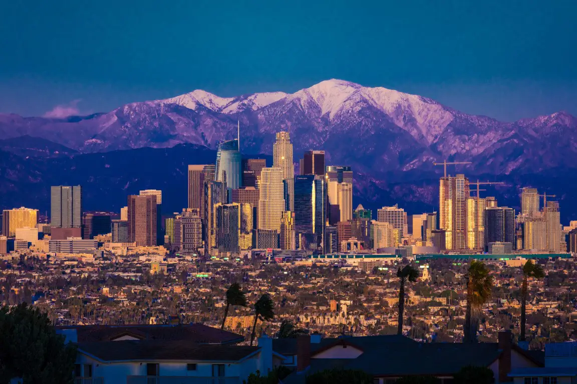 Los Angeles Skyline framed by San Bernadino Mountains and Mount Baldy with fresh snow.