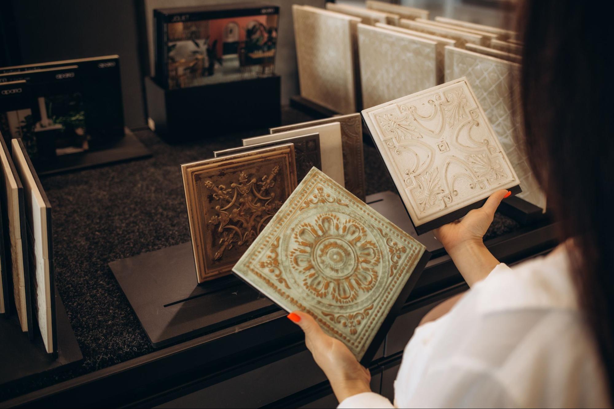 Rear view of a woman selecting new ceramic tiles.